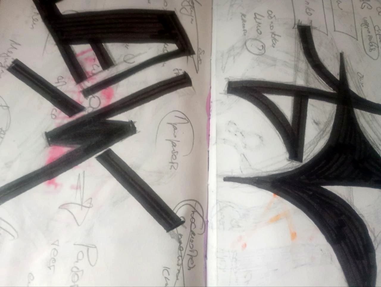 Angular black strokes over a notebook spread.