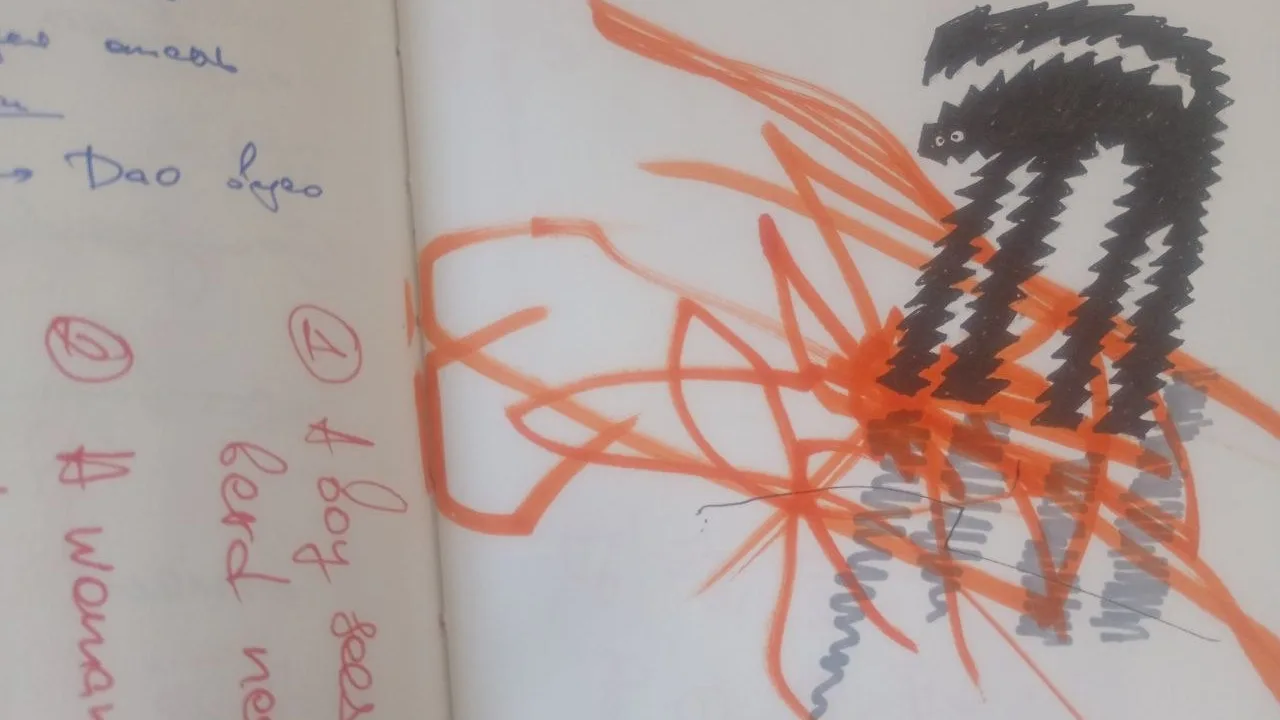 An original sketchbook photograph with an angular black creature over orange lines and handwritten notes.