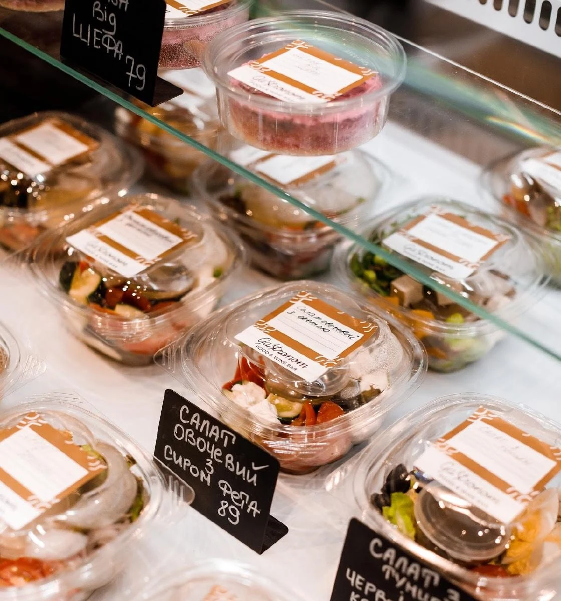 Packaged takeaway salads in Gastronom's chilled display.