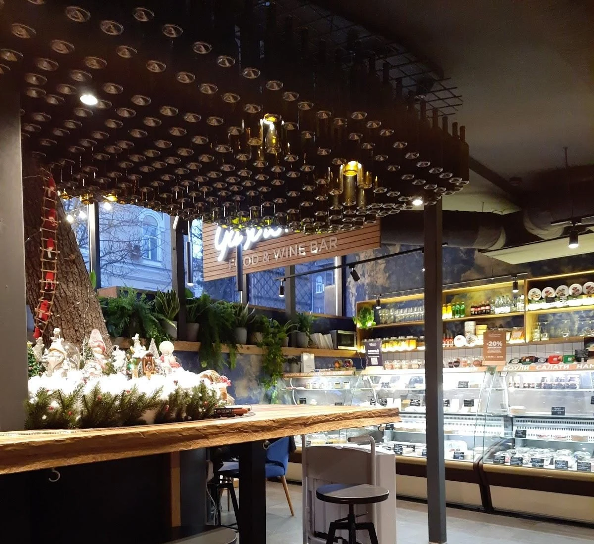 Gastronom retail counter, seating and wine displays in the implemented venue.